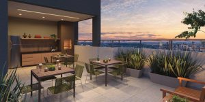 Cury Like Campo Limpo, com mesas, churrasqueira, cozinha equipada e vista panorâmica da cidade ao pôr do sol.