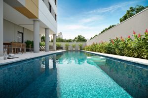 Piscina do Parque das Nações Cury com deck, espreguiçadeiras e área de convivência na Rua Luiz Seraphico Júnior, 326 – São Paulo.