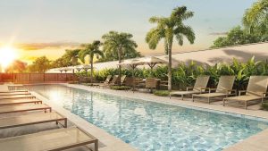 Piscina do Cidade Parque Guarapiranga Cury, área de lazer do condomínio Rio Bonito com espreguiçadeiras e paisagismo.